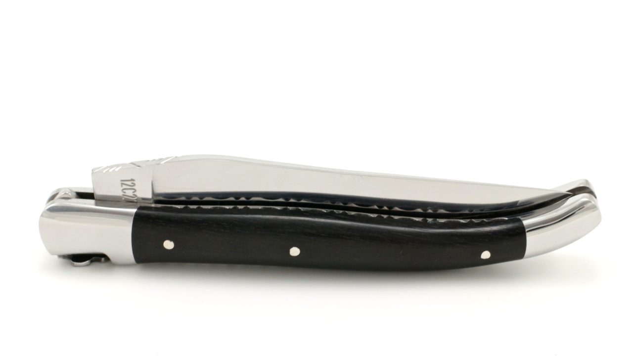 Laguiole en Aubrac ebony Fleur de lis chiseled plates 12 cm