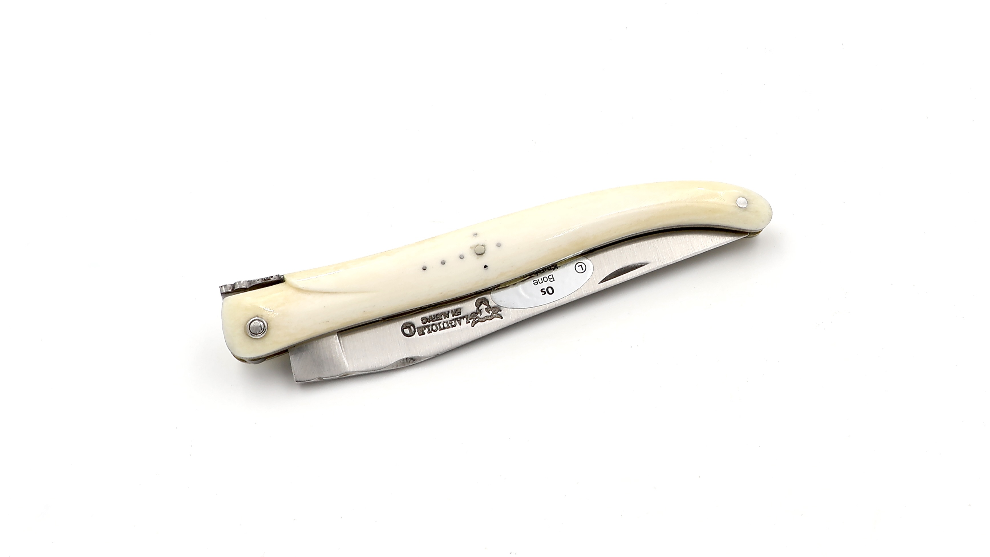 Laguiole en Aubrac double plates knife full handle with brass plates cow bone 12 cm Laguiole en Aubrac double plates knife full handle with brass plates cow bone 12 cm