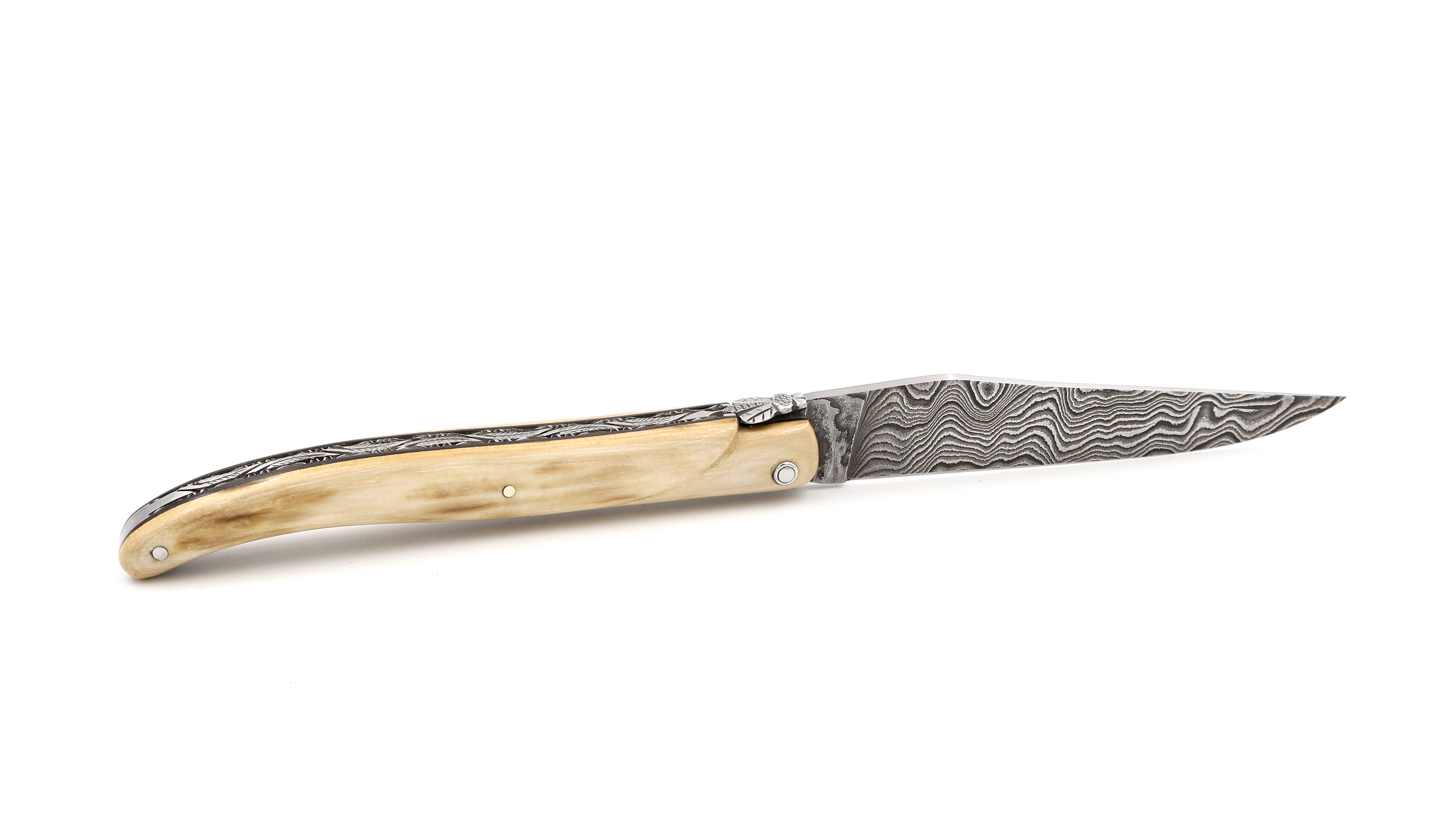 Laguiole en Aubrac Mammoth ivory crust full handle with chiseled plates damascus blade 12 cm